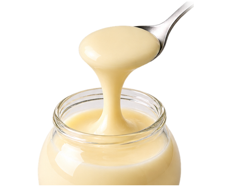 A spoon lifting Mochi Pudding out of a glass jar
